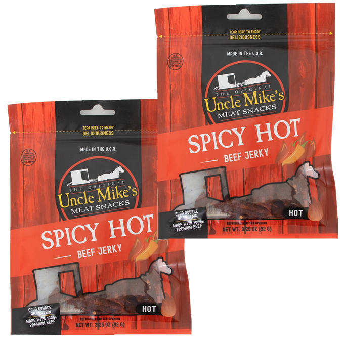 Two sealed bags of spicy hot beef jerky featuring red and black packaging with clear windows showing dark jerky strips, highlighting a gluten-free, protein-rich snack made in USA for Kitchen & Food, Snacks and Sweets, Meats, and Best Sellers collections.