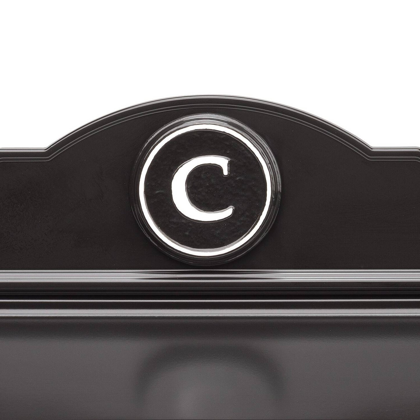 Close-up of a handcrafted black and white custom wall mount mailbox featuring a raised circular monogram letter "C," designed to enhance curb appeal in Home & Decor and USA Made collections.