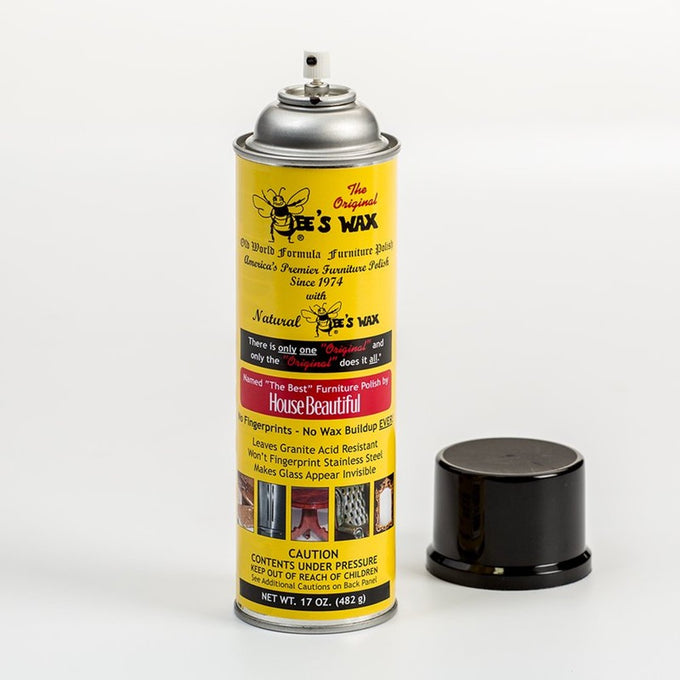 Tall yellow spray can labeled with vintage style text and images promoting a beeswax formula for furniture polish, presented with a black cap, part of Home & Decor and USA Made collections.