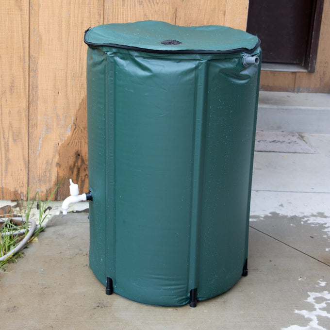 Green collapsible rain barrel with attached white spigot and overflow valve, designed for easy water collection in farm, garden, and lawncare settings, featured in best sellers.