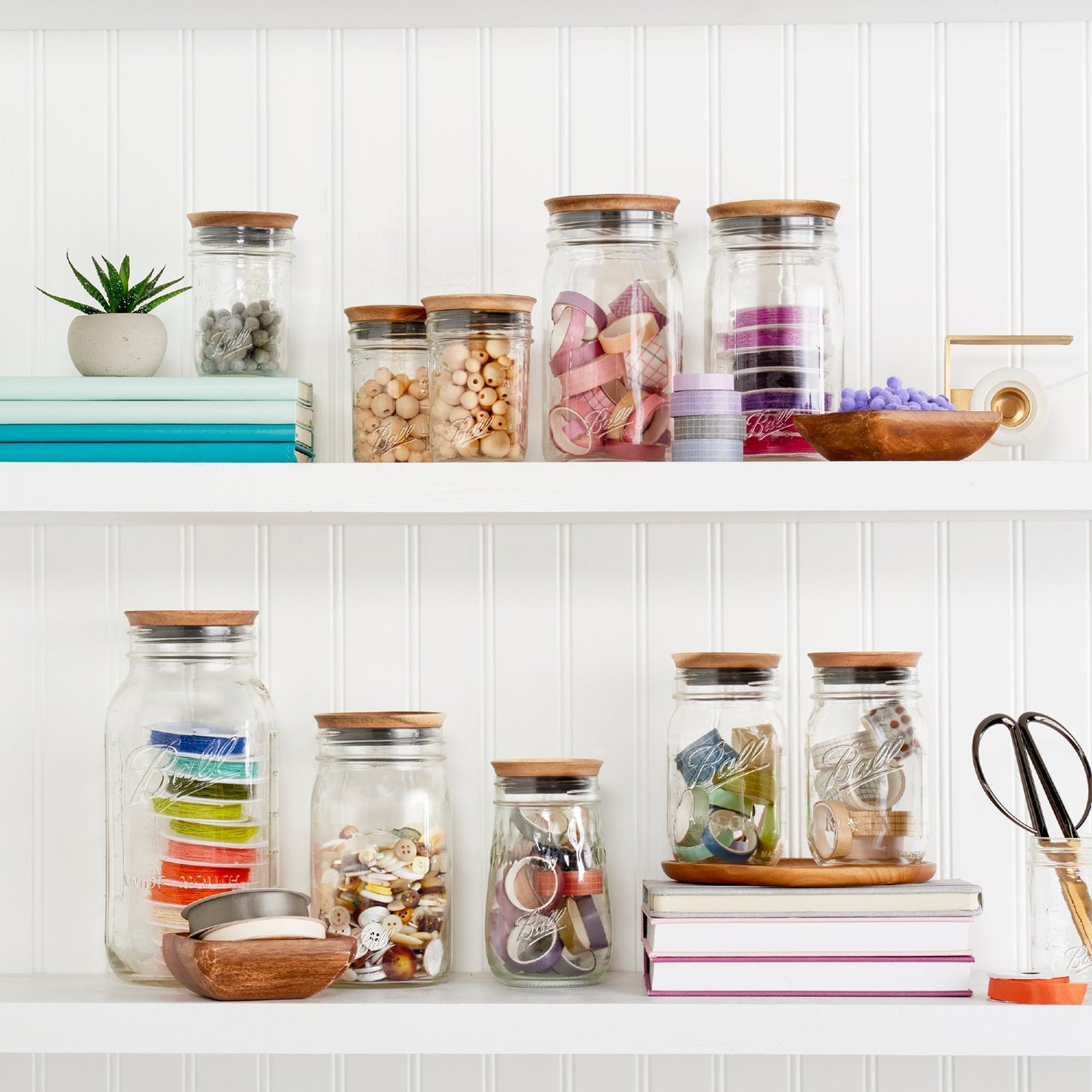Set of handcrafted acacia wooden lids sealing various wide mouth glass jars filled with craft supplies and pantry items, arranged on white shelving in Kitchen & Food, Storage and Serving, Best Sellers, and Promo Eligible collections.