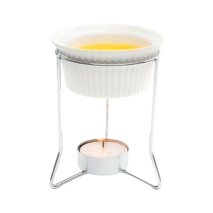 Ceramic butter warmer held on a metal stand with a lit tealight below, designed for gentle heating of butter and delicate sauces, featured in Kitchen & Food and Storage collections.