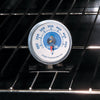 Aluminum oven thermometer with clear temperature dial in Fahrenheit, designed to hang or stand upright, ideal for monitoring heat in kitchen, stoves, cookware, and baking supplies collections.