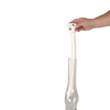 Hand holding a flexible white foam brush with a textured surface inserted into a glass chimney, designed for thorough cleaning, USA made and ideal for lamps and lighting maintenance.