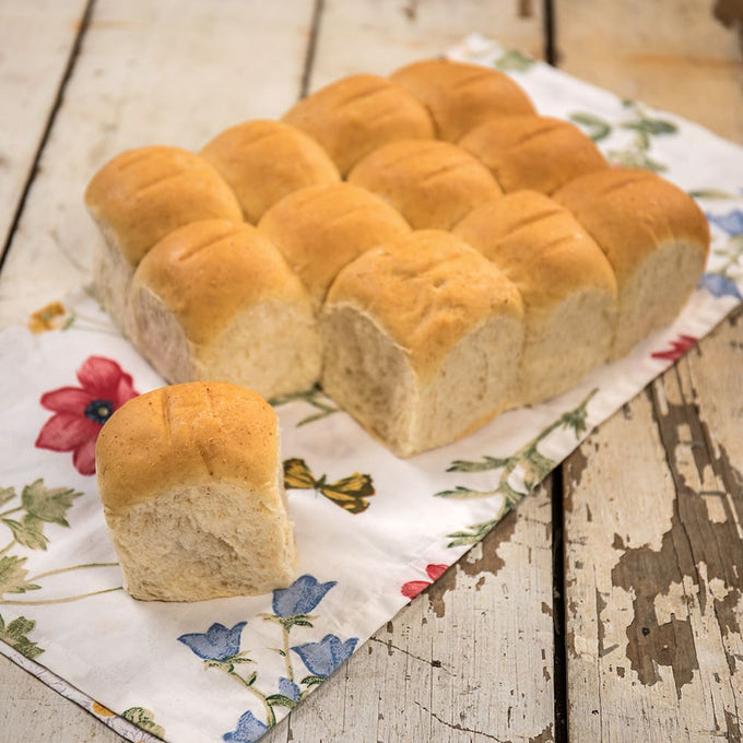 Pack of twelve soft, freshly baked dinner rolls with light golden tops, handcrafted in USA, ideal for Kitchen & Food, Food, Snacks and Sweets, USA Made, Best Sellers, and Promo Eligible collections.