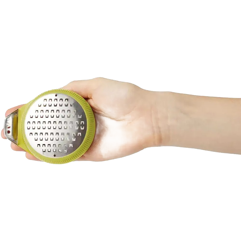 Handheld PalmZester citrus tool with ergonomic green silicone grip and stainless steel grating surface, ideal for Kitchen & Food, Kitchen Gadgets, Cooking and Baking Helpers, Best Sellers, and Promo Eligible collections.