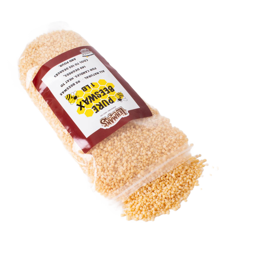 Bag of natural beeswax pellets for candle making, handcrafted and ideal for lamps, candlemaking supplies, and clean-burning candle projects.