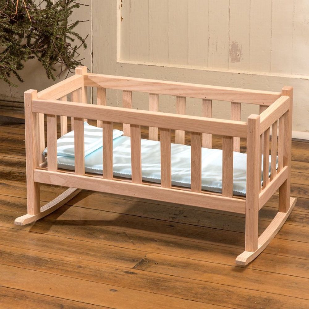 Handcrafted solid oak doll cradle with smooth natural finish and slatted sides, Amish made for indoor play and doll accessories in children's toys and USA Made collections.