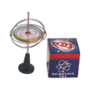 Metal gyroscope with spinning disc mounted on a black plastic stand next to a colorful vintage-style box, featuring classic scientific toy design, part of USA Made and Toys, Books & Games collections.