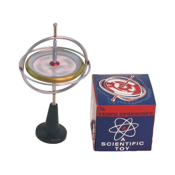 Metal gyroscope with spinning disc mounted on a black plastic stand next to a colorful vintage-style box, featuring classic scientific toy design, part of USA Made and Toys, Books & Games collections.