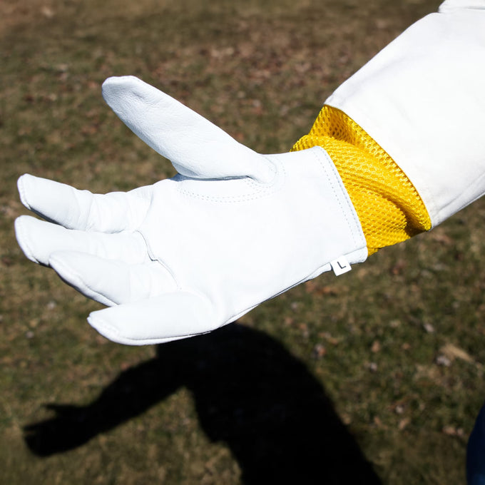Close-up of a smooth goatskin glove with elastic vented yellow cuff designed for dexterity and protection, featured in farm, garden, and beekeeping gear collections.