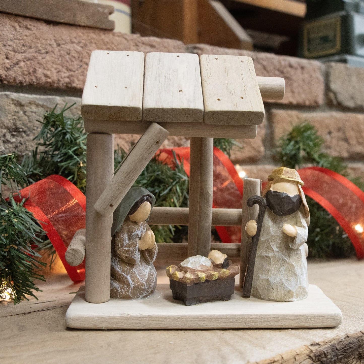 Handcrafted wooden and resin nativity scene featuring simple stable with attached Holy Family figures, ideal for Home & Decor, Holiday Decor, Best Sellers, and Promo Eligible collections.