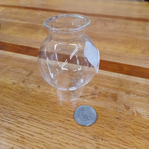 Handblown clear glass chimney with a rounded body and flared top, designed as a replacement part in Lamps & Lighting, Parts and Accessories, and Chimneys and Globes collections.