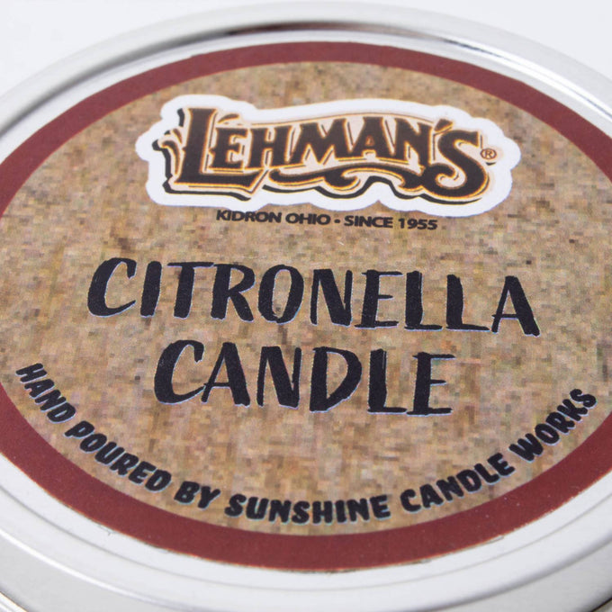 Close-up of a hand-poured citronella candle tin lid featuring Lehman's branding, crafted for outdoor use in camping, pest control, and garden lighting collections.
