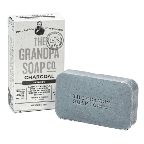 Handcrafted bar of charcoal soap with embossed branding and vintage-style box packaging, perfect for Health & Wellness, Grooming and Personal Hygiene, Soaps, USA Made, Best Sellers, and Promo Eligible collections.