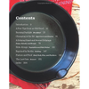 Contents page of a cookbook displayed inside a black iron skillet on a rustic wooden surface with a red bandana, featured in Toys, Books & Games, Cookbooks, and Best Sellers collections.
