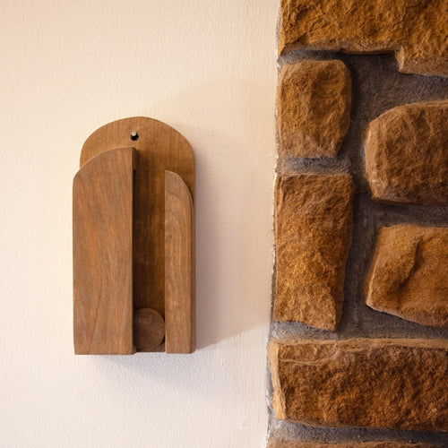 Handcrafted Amish-made wooden wall broom holder in natural finish with sliding ball mechanism mounted beside a stone wall, ideal for Home & Decor, Household Helpers, and USA Made collections.