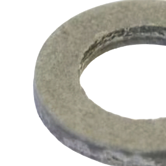 Close-up of a round metal washer or bushing with a textured surface, designed to reduce friction in kitchen and food specialty equipment, including butchering supplies in best sellers and promo collections.