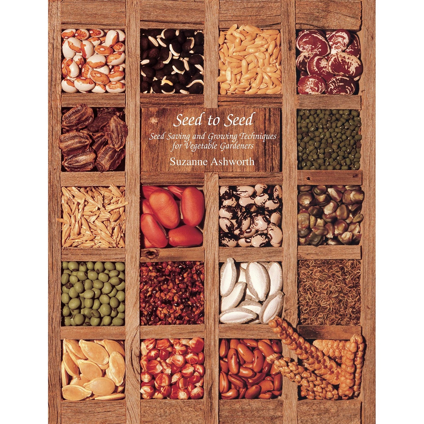 Cover of a handcrafted book featuring an organized wooden tray filled with various vegetable seeds, highlighting seed saving and growing techniques, featured in Toys, Books & Games, Books, and Home and Garden How-To Books collections.