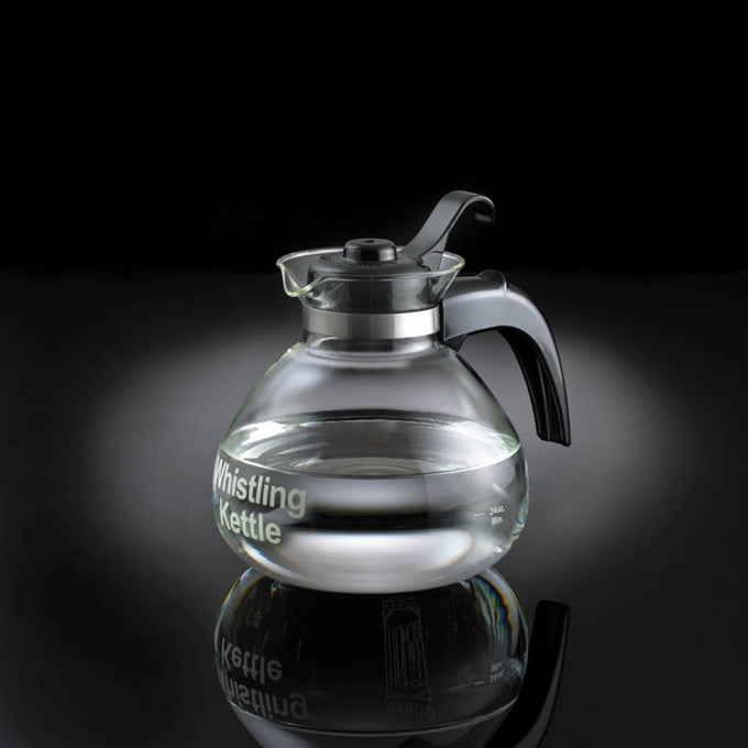 Clear glass whistling kettle with black handle and stainless steel band holding water, designed for Kitchen & Food, Brewing Coffee and Tea, Best Sellers, and Promo Eligible collections.