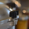 Close-up of a durable black locking knob securing the lid on a handcrafted stainless steel pressure canner, featured in Kitchen & Food, Food Preservation, and USA Made collections.
