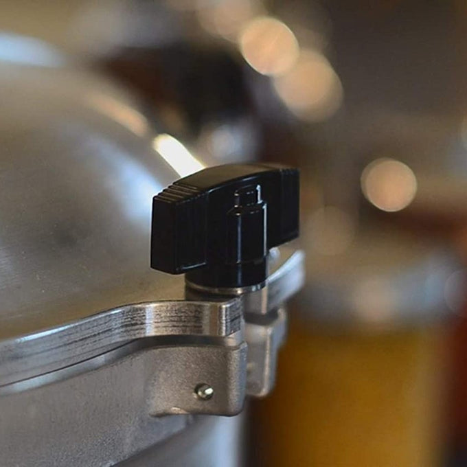 Close-up of a durable black locking knob securing the lid on a handcrafted stainless steel pressure canner, featured in Kitchen & Food, Food Preservation, and USA Made collections.