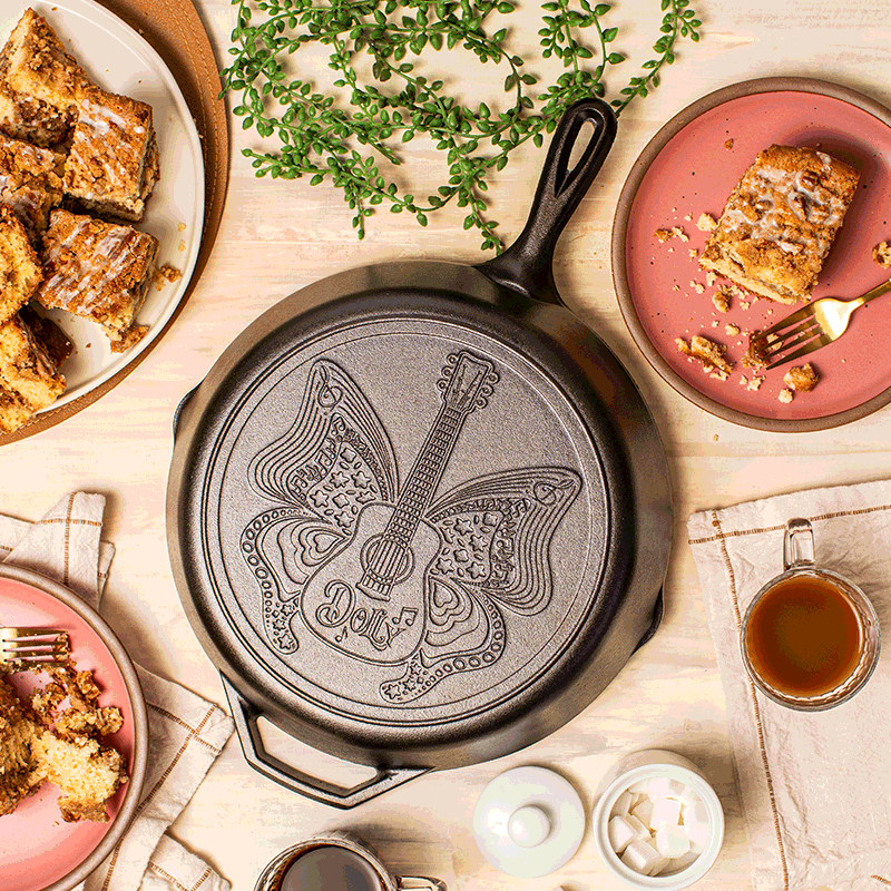 12-inch cast iron skillet featuring an intricate butterfly and guitar design with "Dolly" inscription, handcrafted in USA, ideal for Kitchen & Food, Cookware, Cast Iron, USA Made, Best Sellers, and Promo Eligible collections.
