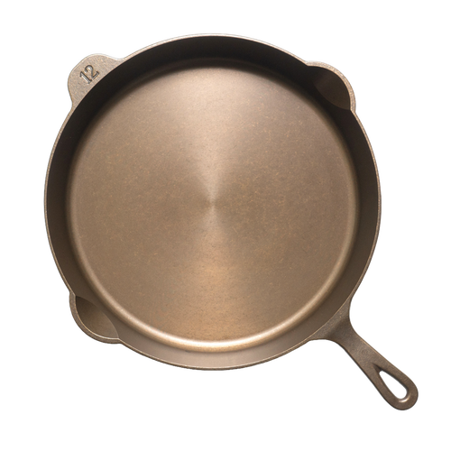 Top view of a handcrafted, lightweight cast iron skillet with smooth cooking surface and a "12" embossed, designed for Farm, Garden & Tool, Kitchen & Food, Camping, Cookware, Cast Iron, USA Made, and Best Sellers collections.