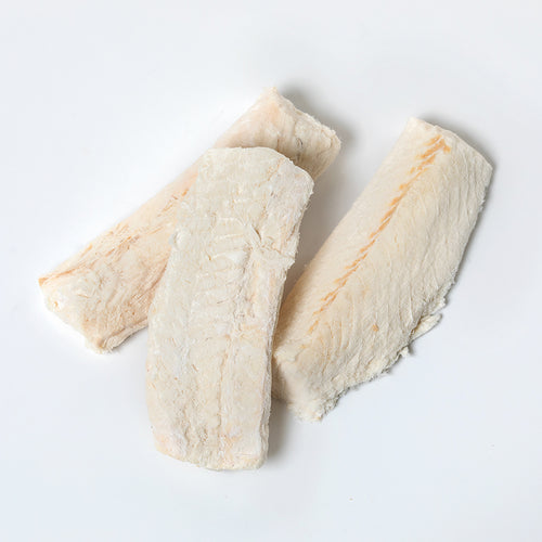 Three freeze-dried cod fillets arranged on a white background, highlighting their natural texture and durability, suitable for long-term food storage and emergency supplies.