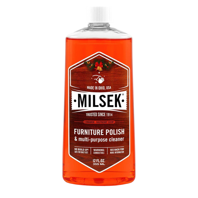 Clear plastic bottle of orange-hued wood furniture polish and multi-purpose cleaner with white cap and vintage-style label, ideal for Home & Decor, Household Cleaning, and USA Made collections.