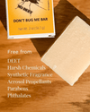 Natural bug-repelling soap bar and packaging highlighting its free-from DEET, harsh chemicals, synthetic fragrances, aerosol propellants, parabens, and phthalates qualities, ideal for Health & Wellness collections.