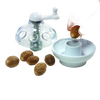 Transparent spice grinder with a white crank handle and stainless steel blades, designed for safely grinding nuts and hard spices, ideal for Kitchen & Food, Brewing Coffee and Tea, and Best Sellers collections.