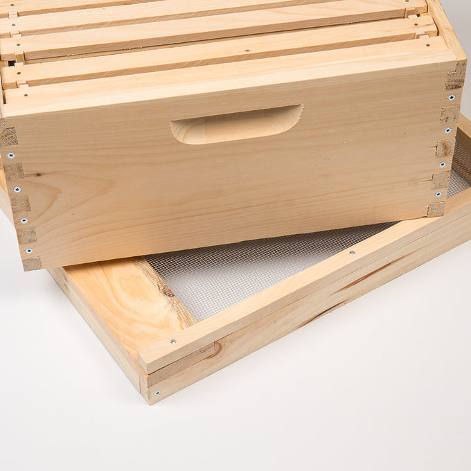 Handcrafted wooden beehive box with built-in handle and a screened bottom board, featuring durable Amish-made construction, ideal for farm, garden, and beekeeping supplies.