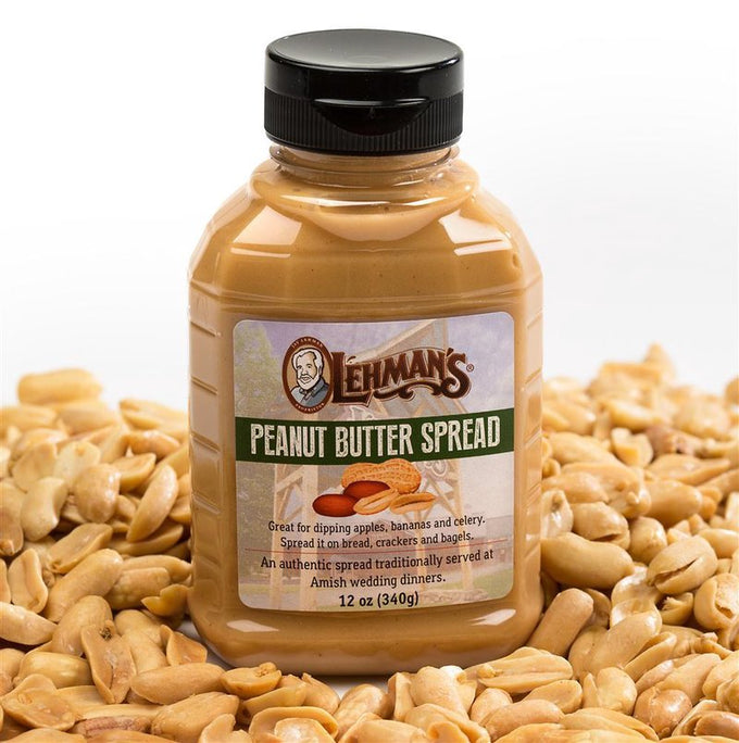 Jar of smooth, creamy Lehman's peanut butter spread with a black lid, surrounded by shelled peanuts; handcrafted, made in USA, part of Kitchen & Food and Best Sellers collections.