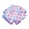 Stack of colorful, super soft fleece squares with fringe edges in pastel floral and solid purple and blue patterns, designed for a hands-on flower quilt craft in children's arts and crafts collections.