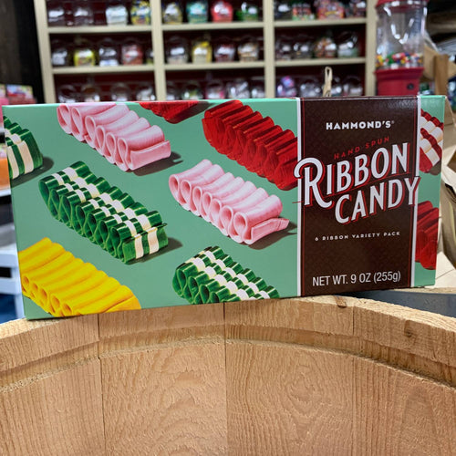 Colorful handcrafted handspun ribbon candy in assorted flavors displayed on packaging, highlighting a unique USA made treat from Kitchen & Food and Snacks and Sweets collections.