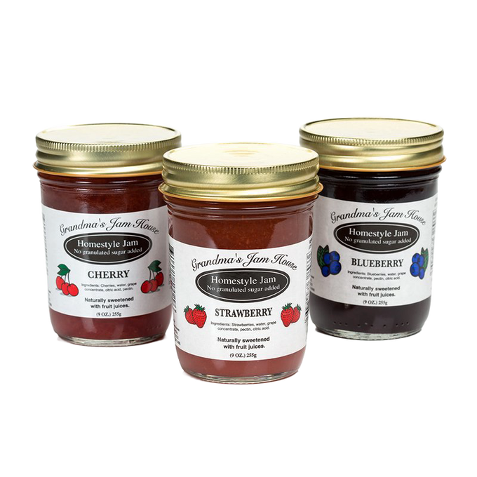 Three handcrafted glass jars of no sugar added homestyle jam in cherry, strawberry, and blueberry flavors, made in USA and featured in Kitchen & Food, Food, Peanut Butter & Jellies, USA Made, Best Sellers, and Promo Eligible collections.