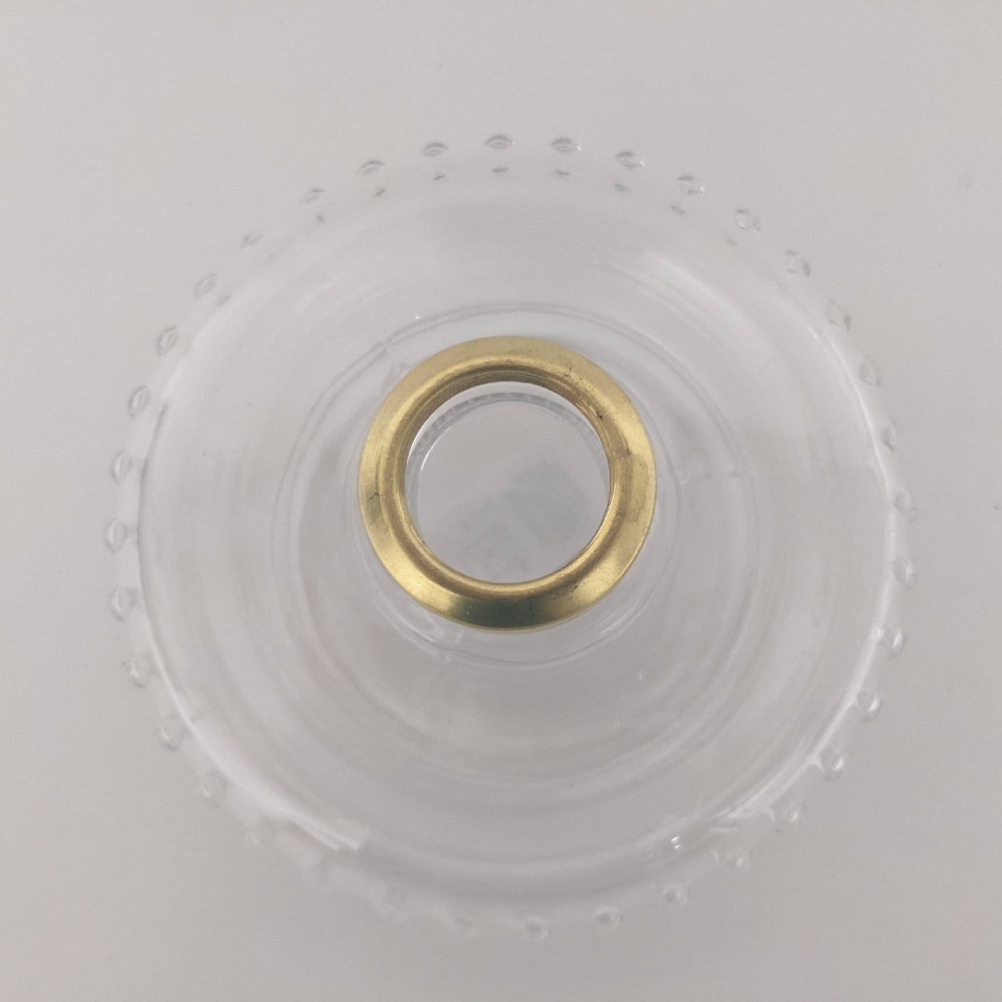 Clear glass oil lamp bracket font with polished brass collar featuring decorative raised detailing, designed for use in lamps & lighting, oil lamps, wall lamps, best sellers, and promo collections.