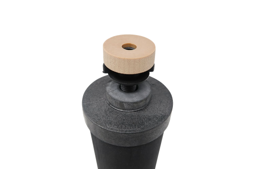 Close-up of a black water filter element with gray top and wooden knob, designed for gravity-fed filtration systems in appliances and water treatment collections.