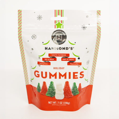 Resealable bag of handcrafted, USA-made holiday gummies shaped like Christmas trees and snowmen in red, green, and white sugar coating, featured in Kitchen & Food and Candy collections.