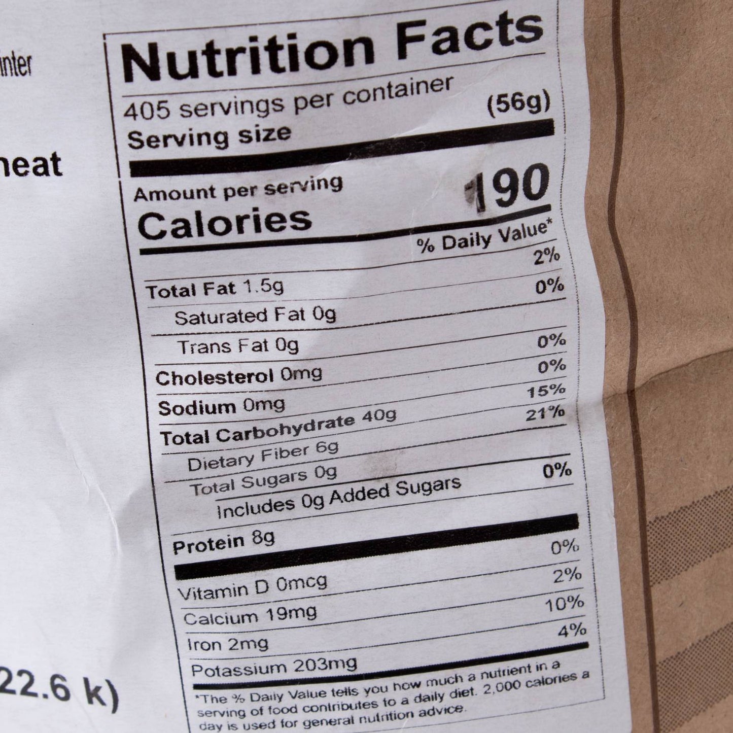 Close-up of nutrition facts label on a 50 lb bag of Hard Red Winter Wheat showing calories, fat, carbohydrates, protein content, and minerals, featured in Pantry, Food, and USA Made collections.