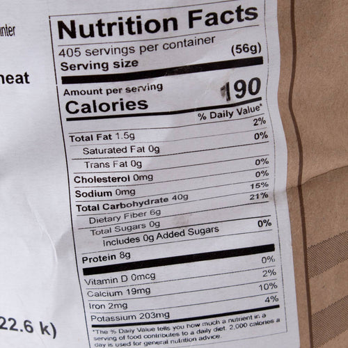 Close-up of nutrition facts label on a 50 lb bag of Hard Red Winter Wheat showing calories, fat, carbohydrates, protein content, and minerals, featured in Pantry, Food, and USA Made collections.