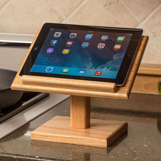 Handcrafted oak stand with a clear, smooth finish holding a tablet upright on a kitchen counter, ideal for reading recipes in Kitchen & Food, Amish Made, USA Made collections.