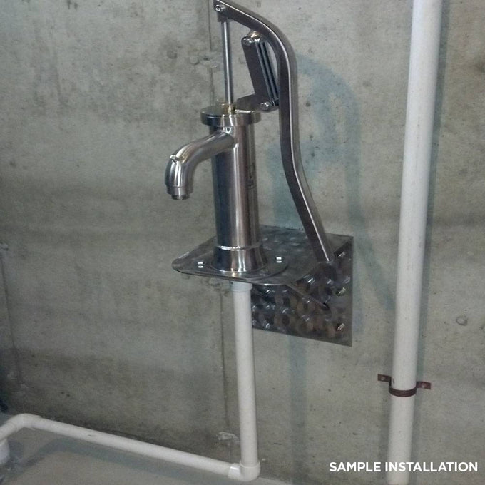 Handcrafted stainless steel shallow well pump mounted on a concrete wall, featuring a rust-resistant lever and spout, ideal for Appliances and Water Pumps collections, made in USA.