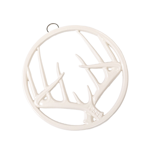 Round enamel trivet in off-white with an antler design, featuring a built-in hanger and rubber feet, perfect for Kitchen & Food, Dinnerware, Storage and Serving, Best Sellers, and Promo Eligible collections.