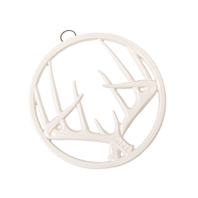 Round enamel trivet in off-white with an antler design, featuring a built-in hanger and rubber feet, perfect for Kitchen & Food, Dinnerware, Storage and Serving, Best Sellers, and Promo Eligible collections.