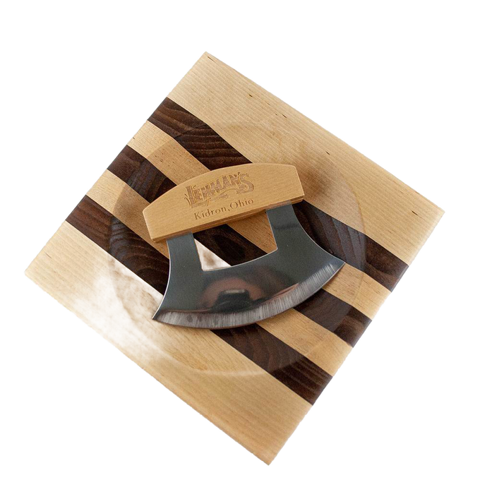 Handcrafted ulu knife with crescent-shaped stainless steel blade and wooden handle resting on a striped wooden chopping bowl, ideal for food prep and kitchen gadgets collections.