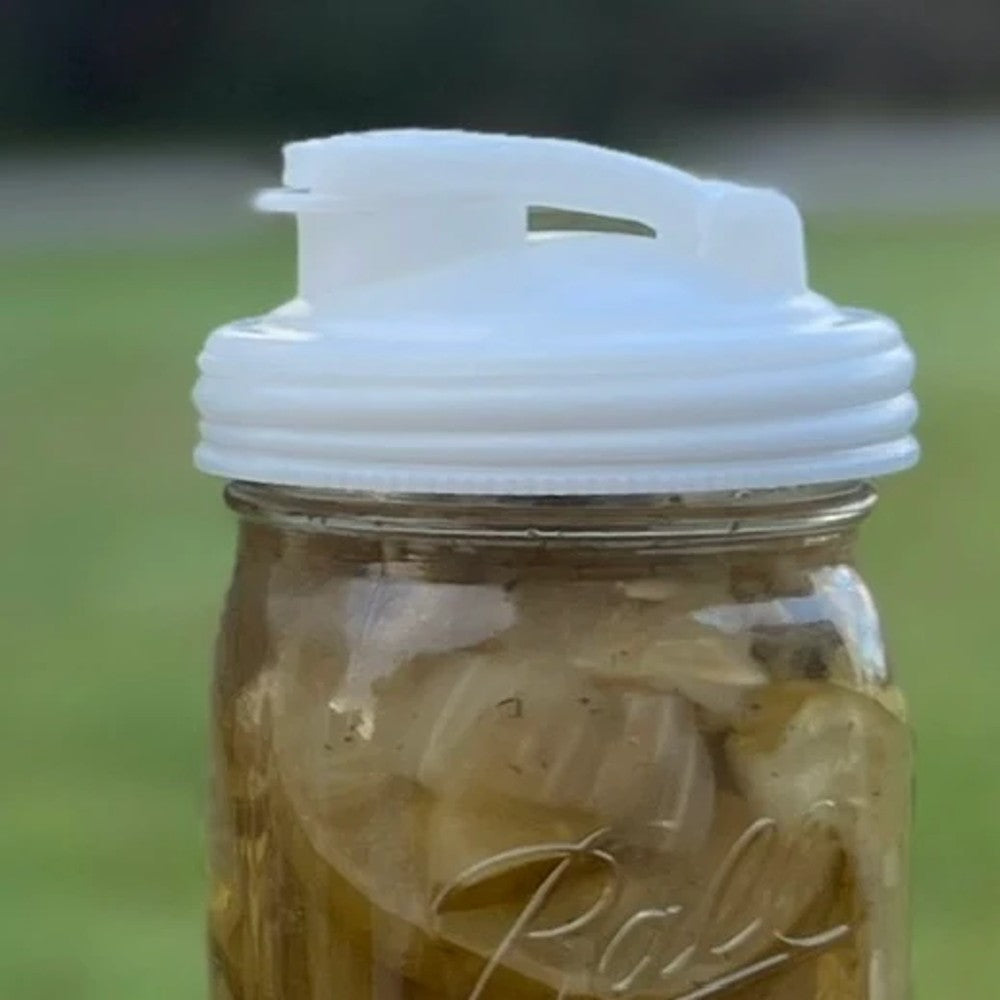 Translucent white wide-mouth pour lid with flip-top spout and carry loop, crafted from no-break plastic in the USA, ideal for kitchen use and featured in best-selling Kitchen & Food and Kitchen Gadgets collections.