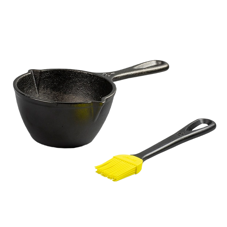 Black cast iron melting pot with a handle, accompanied by a black brush with yellow silicone bristles, designed for even heat retention, ideal for Kitchen & Food and Cast Iron collections.