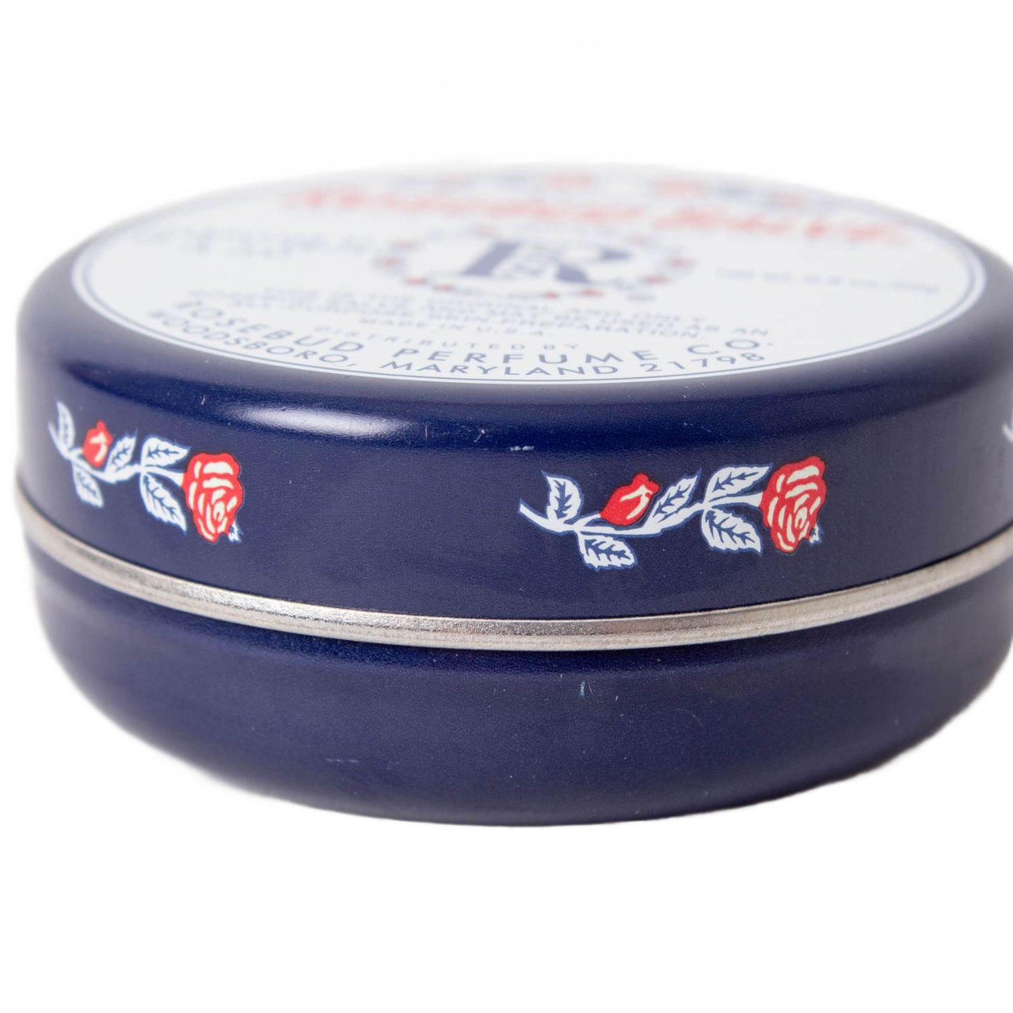 Round navy blue metal tin of handcrafted Original Rosebud Salve with vintage rose design, made in USA, perfect for Health & Wellness, Health Remedies, and Best Sellers collections.